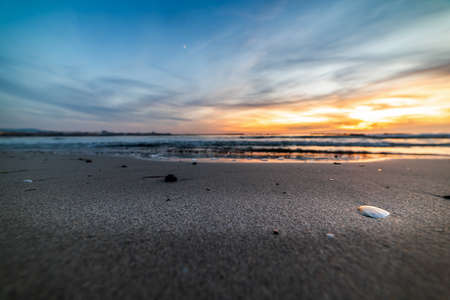 Sandy shore in Alghero at sunset. Sardinia, Italyの写真素材