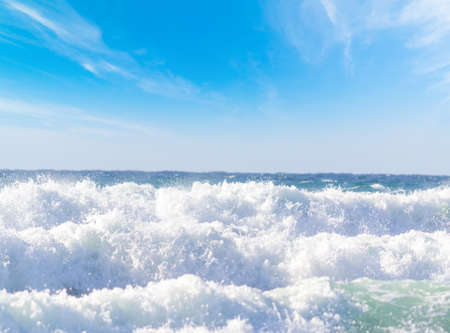 White waves on a windy day in Sardinia, Italyの写真素材