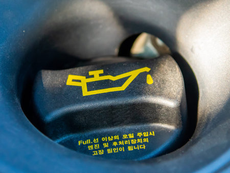 Extreme close up of an oil cap of a modern car engine