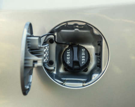 Close up of a diesel fuel cap of a grey carの写真素材