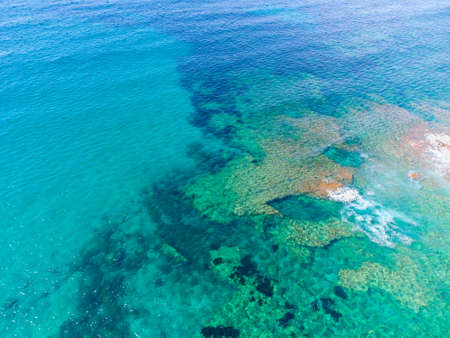 Turquoise water on a sunny day in Alghero shore seen from above. Sardinia, Italyの写真素材