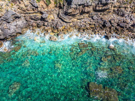 Crystal clear water by Alghero rocky shore. Sardinia, Italyの写真素材