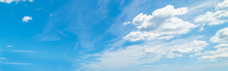 Blue sky with soft clouds in summertime in Sardiniaの写真素材