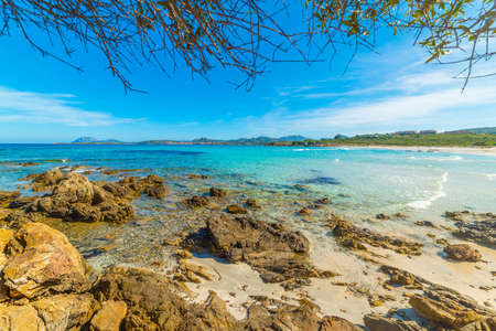 Rocks and turquoise water in Rena Bianca beach in Costa Smeralda. Sardinia, Italyの写真素材