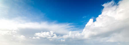Blue sky with huge clouds in winter in Italyの写真素材