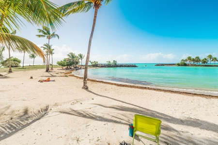 Beach chair in Bas du Fort beach in Guadeloupe, French west indies. Lesser Antilles, Caribbean seaの写真素材
