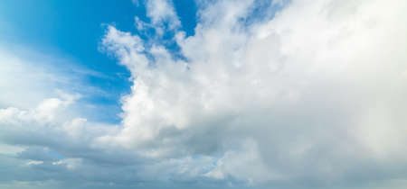 Blue sky and huge clouds in winter in Italyの写真素材