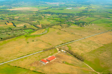 Aerial view of green and yellow fields in Sardinia, Italyの写真素材
