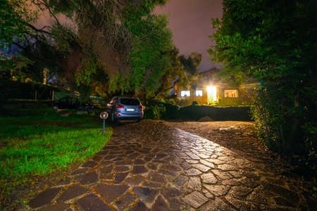 Front view of an italian luxury house by nightの写真素材