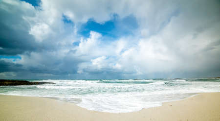 Dramatic sky over Is Arutas beach in winter. Sardinia, Italyの写真素材