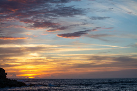 Colorful sky over the sea at sunset. Sardinia, Italyの写真素材