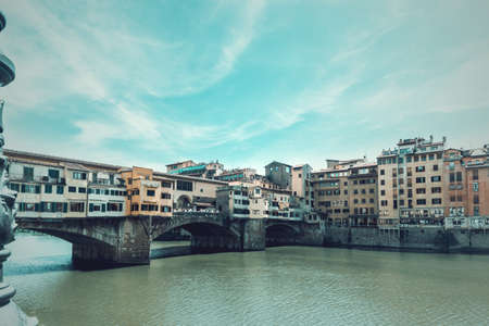 World famous Ponte Vecchio over Arno river in Florence. Tuscany, Italyの写真素材