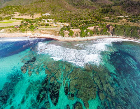 Turquoise water by the shore in Poglina beach. Sardinia, Italyの写真素材