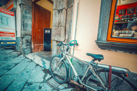 Bicycle parked by and entry door in world famous Sorrento, Italyの写真素材