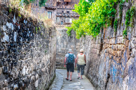 Sorrento, ITA - May 23, 2018: Couple of tourists in a narrow alley in Sorrentoのeditorial素材