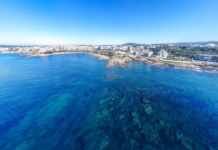 Aerial view of Alghero coastline under a blue sky. Sardinia, Italyの写真素材