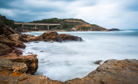 Rough sea in Alghero shore at sunset. Sardinia, Italyの写真素材