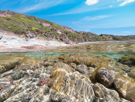 Split underwater view of rocks in La Speranza seabed. Sardinia, Italyの写真素材