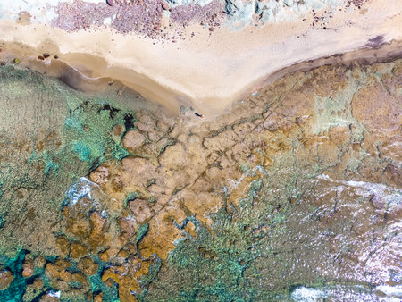 Aerial view of a man alone at the beach. Sardinia, Italyの写真素材