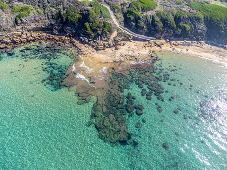 Aerial view of clear water and rocks in Lu Bagnu shoreline. Sardinia, Italyの写真素材