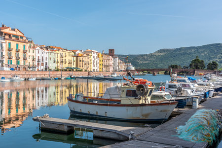 Boats in Temo river with old buildings on the background. Bosa, Italyの写真素材
