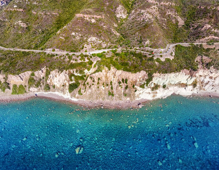 Aerial view of crystal clear water by the rocky shore in Sardinia, Italyの写真素材