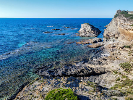 Aerial view of rocks and blue sea in Sardinia, Italyの写真素材