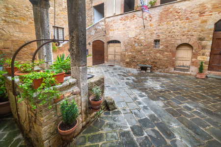 Stone well in a courtyard in Tuscany, Italyの写真素材