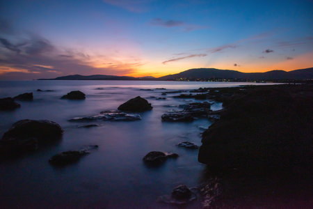 Dark clouds over Alghero shore at sunset. Sardinia, Italyの写真素材