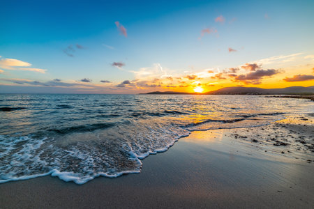 Colorful sky over the sea at sunset in Alghero. Sardinia, Italyの写真素材