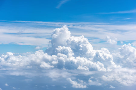 White fluffy cumulonimbus in the blue sky