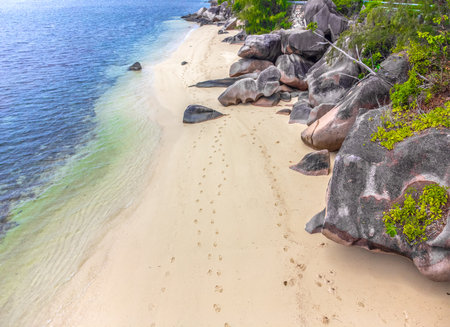 Granite rocks and sand in Anse Citron beach. Praslin island, Seychellesの写真素材