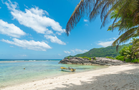 Wooden boat in Anse Forbans beach. Mahe island, Seychellesの写真素材