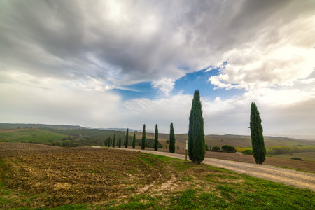 Tuscany countryside under a dramatic cloudy sky, Italyの写真素材