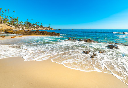 White sand and rocks in Laguna Beach shoreline. California, USAの写真素材
