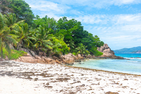 Anse Severe beach under a cloudy sky. La Digue island, Seychellesの写真素材