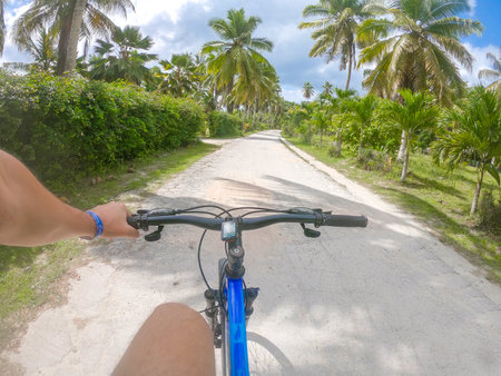 Riding a bicycle in Union Estate park in La Digue island, Seychellesの写真素材