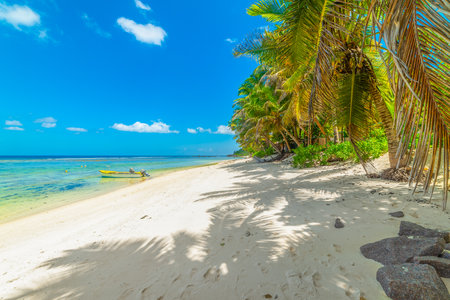Wooden boat in Anse Forbans beach. Mahe island, Seychellesの写真素材