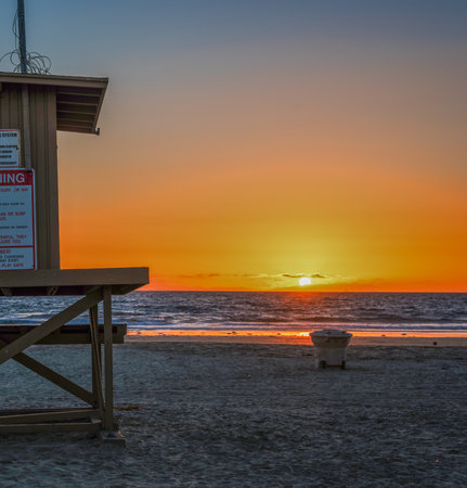 a lifeguard tower in Newport Beach at sunset, Californiaの写真素材