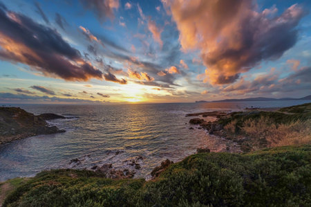 Dramatic sky over Alghero shore at sunset. Sardinia, Italyの写真素材