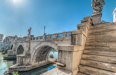 Sant Angelo bridge under a shining sun in Rome, Italyの写真素材