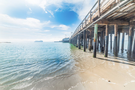 Wooden pier on Santa Barbara shore, Californiaの写真素材