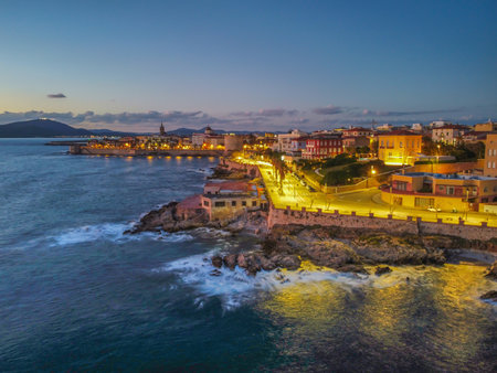 Aerial view of Alghero shoreline by night. Sardinia, Italyの写真素材