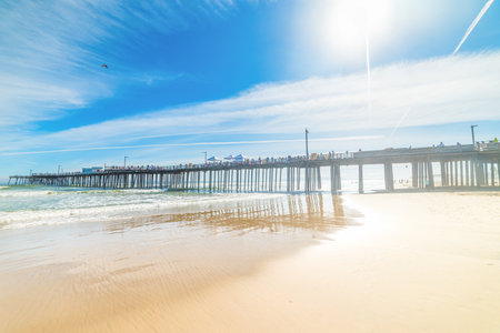 Golden shore by the pier in Pismo beach, Californiaの写真素材