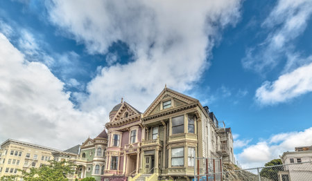 Clouds over world famous Painted Ladies houses in San Francisco, Californiaの写真素材