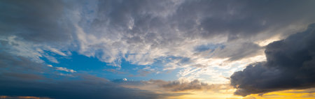 Dramatic sky with dark clouds at sunset
