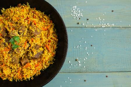 Loose Indian Basmati rice seasoned with special spices with lots of onions and carrots.の写真素材