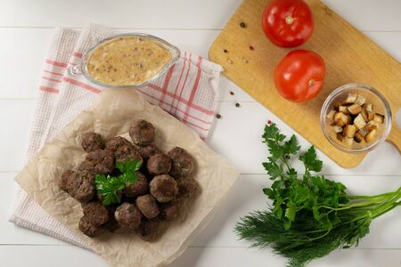 Homemade fried meatballs with herbs on a white background. Swedish traditional cuisine.の写真素材