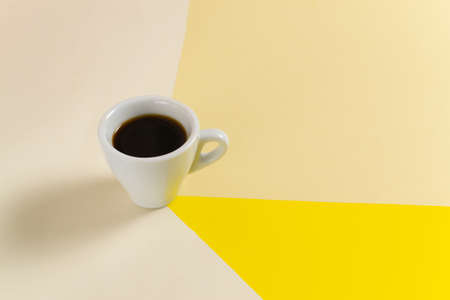 White cup with espresso on a colorful background. Copy space. Selective focus. Horizontal orientation.の写真素材