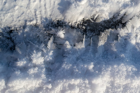 An ice-hole on a frozen river. A dip near the city. Ice bathing concept. Horizontal orientation.の写真素材